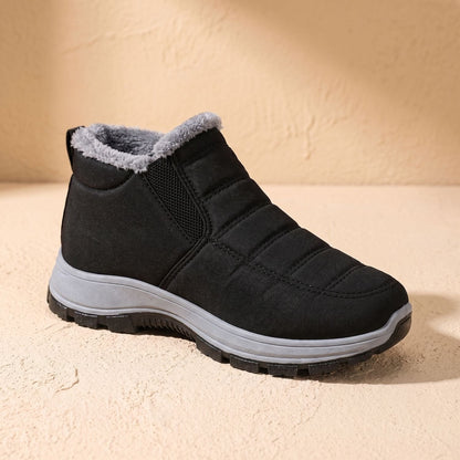 Zijaanzicht van de FLORIN winterboots met geprofileerde antislipzool
