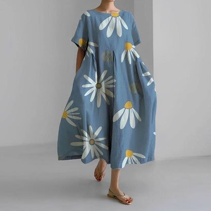 Detailopname van stof en print van de jurk