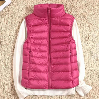 QUENNA bodywarmer in verschillende kleuren naast elkaar